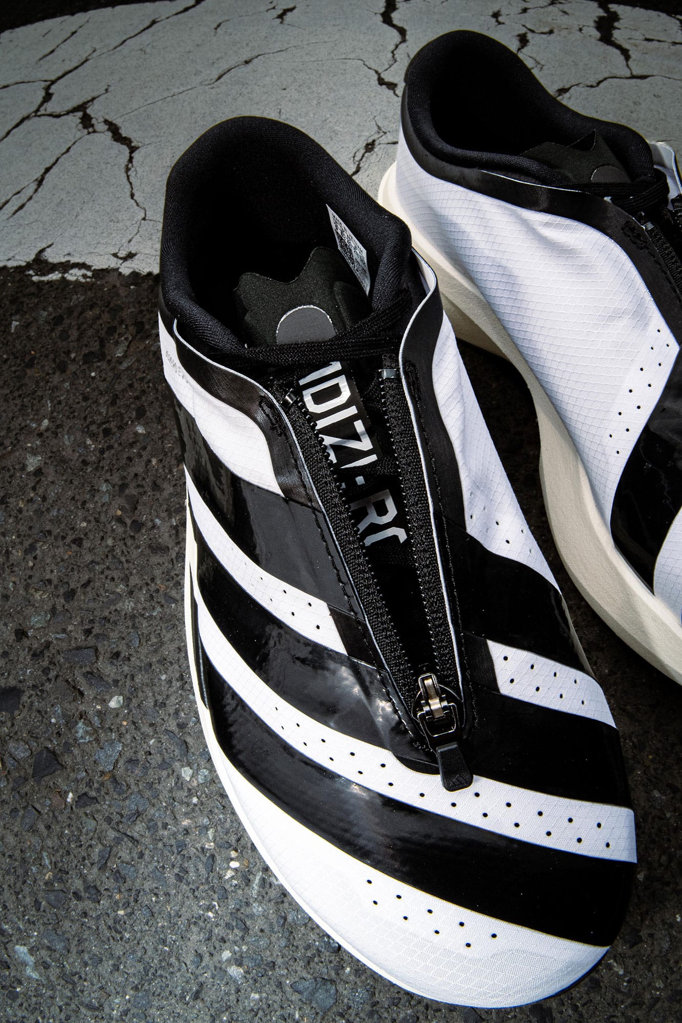 adidas adizero Evo SL ZIP-UP | atmos（アトモス） 公式オンラインストア