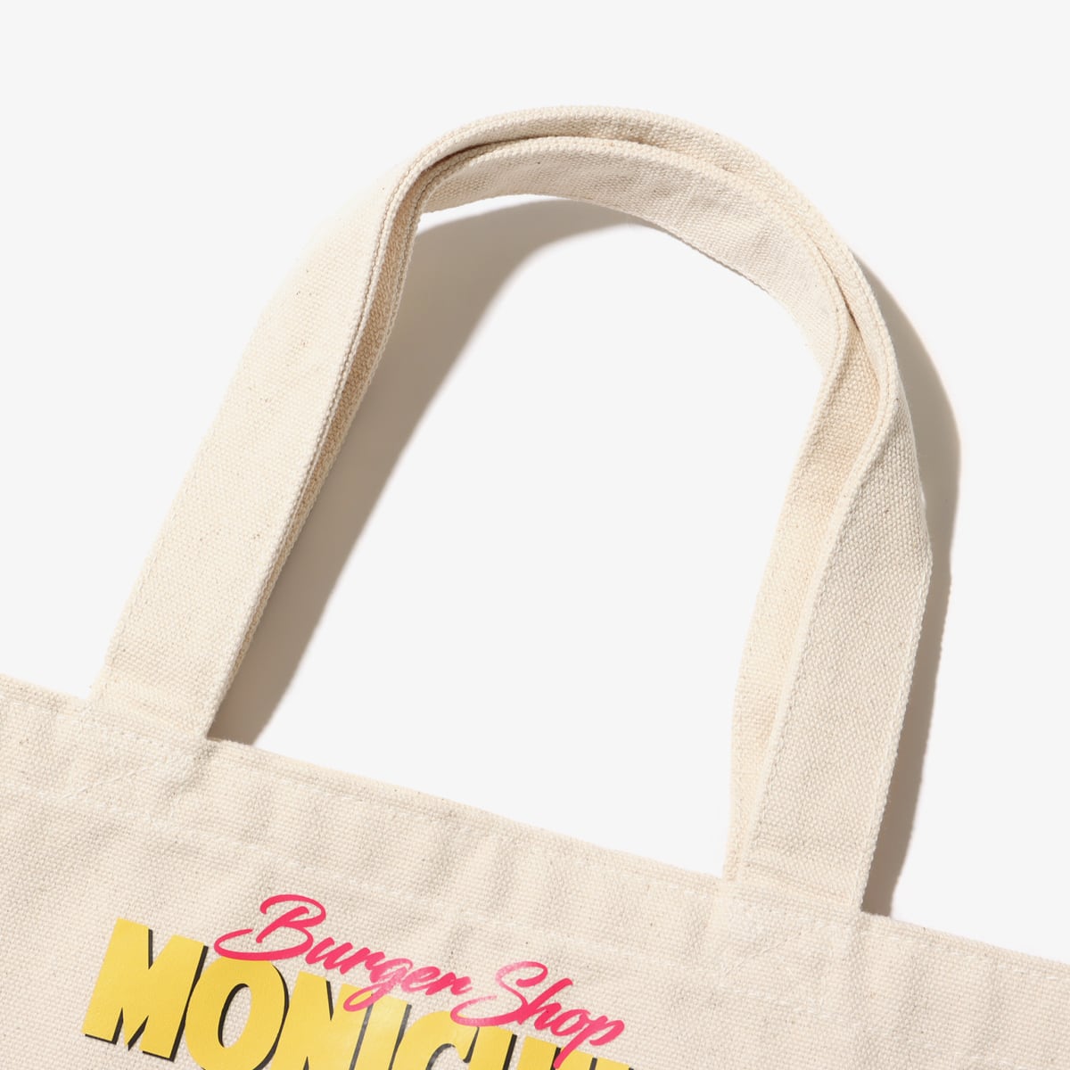 atmos pink x MONICHIKI HOUSE ATMONI TOTE BAG IVORYの画像