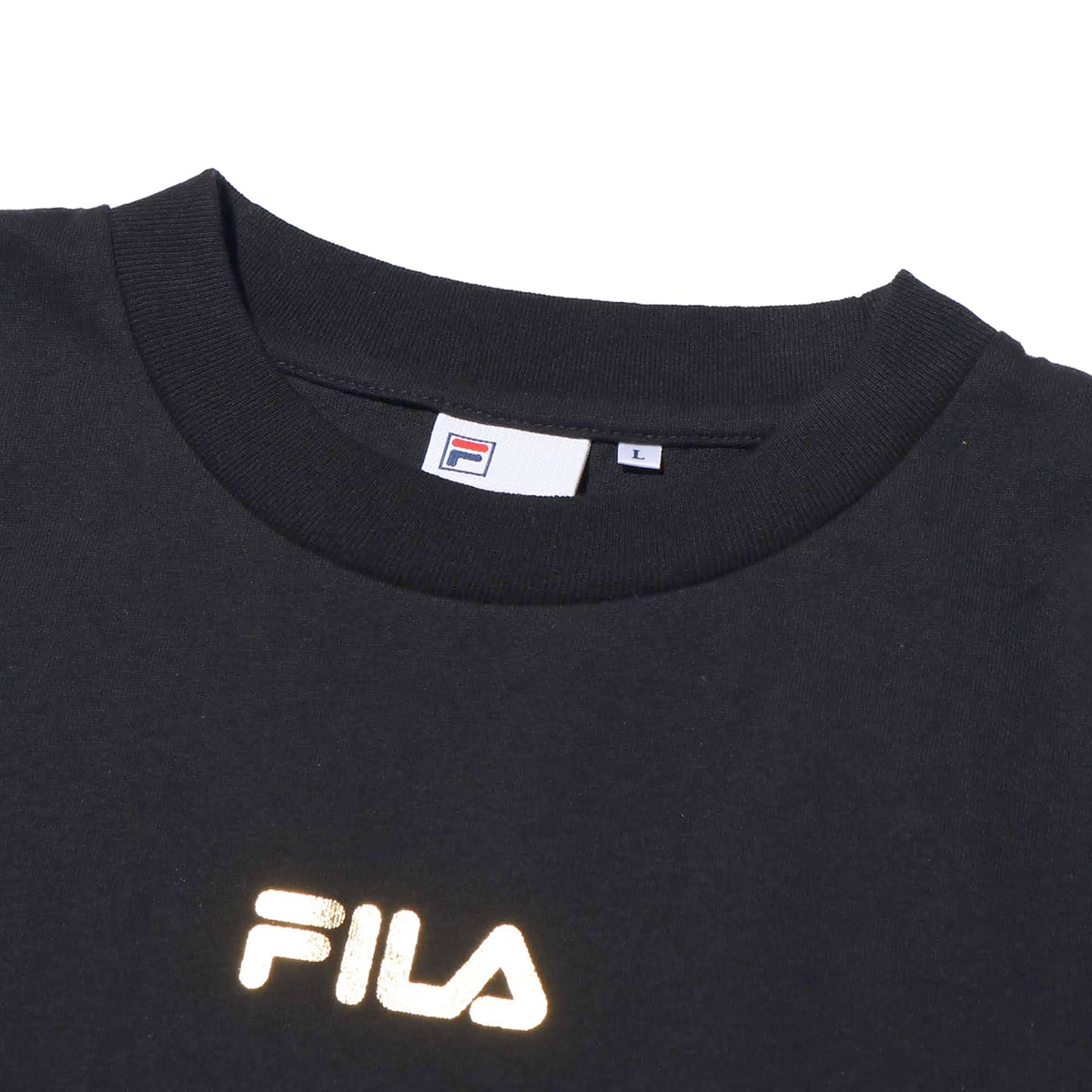 white and gold fila shirt