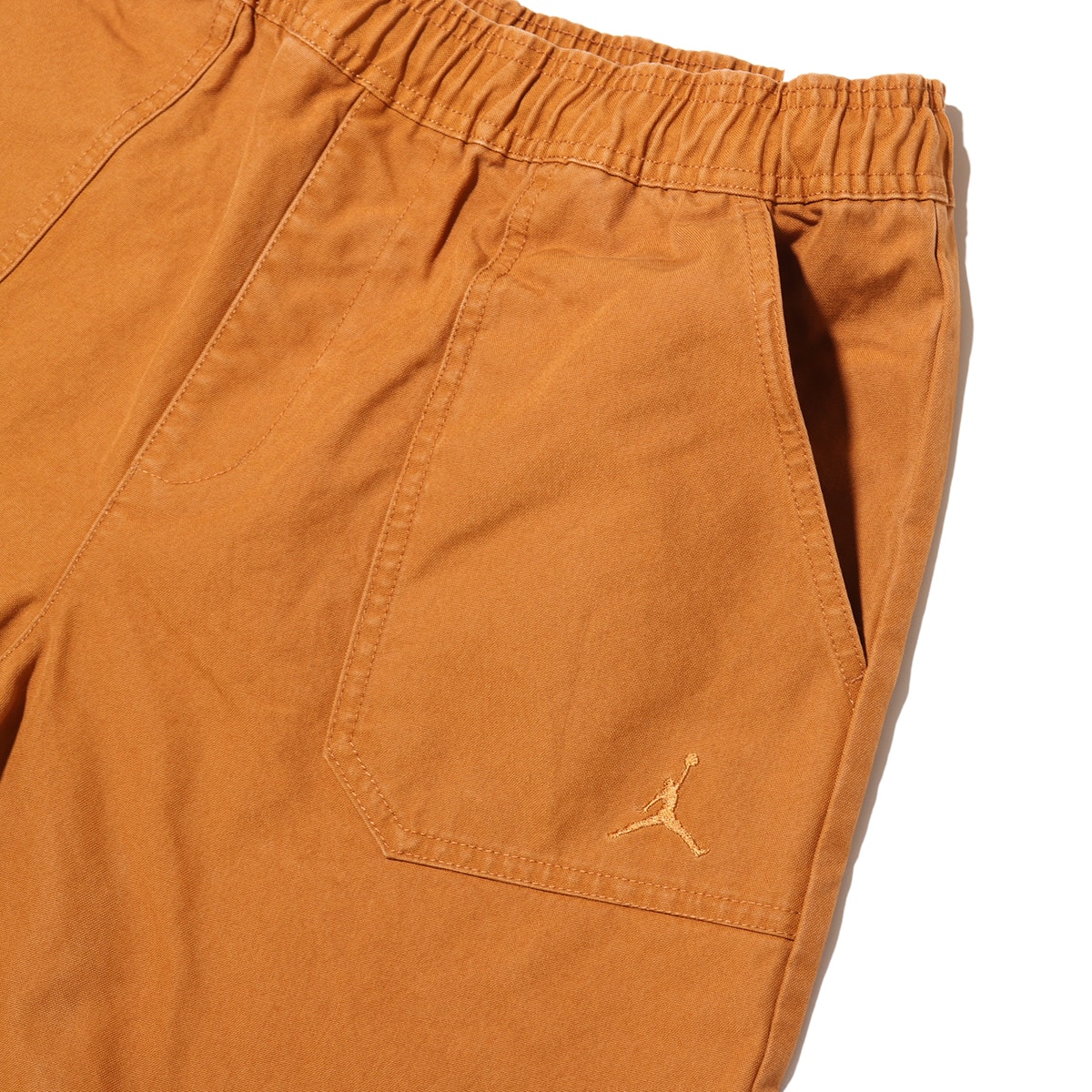 JORDAN BRAND M J ESS STMT WVN SHORT DESERT BRONZE の画像