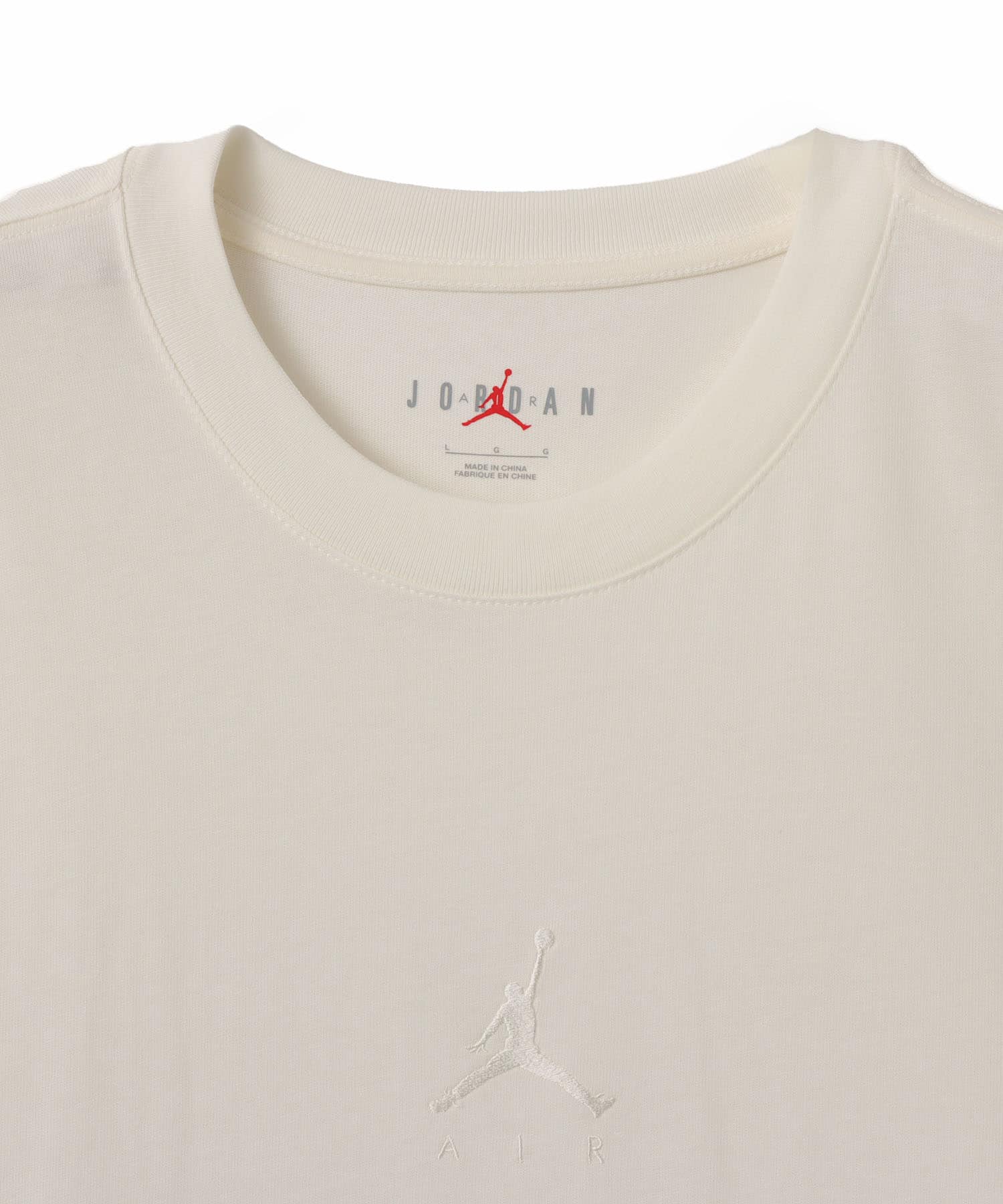 JORDAN BRAND M J FLT ESS OVSZ SS CREW IVORYの画像