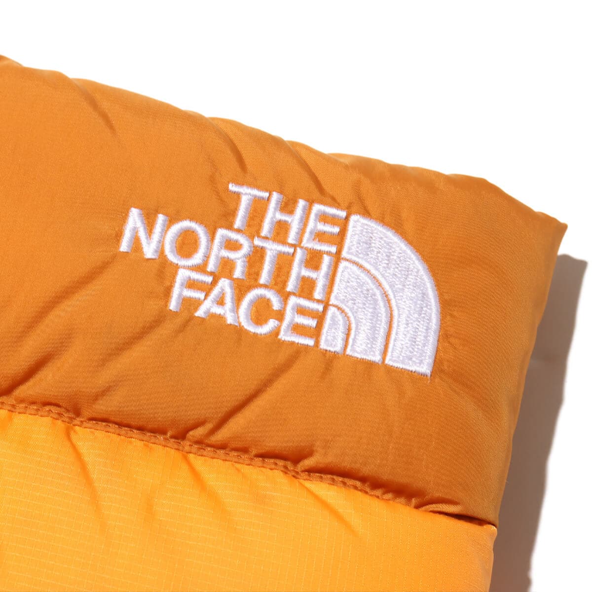 THE NORTH FACE Nuptse Neck Gaiter アイアンシトラス×アプリコットグレーズ の画像