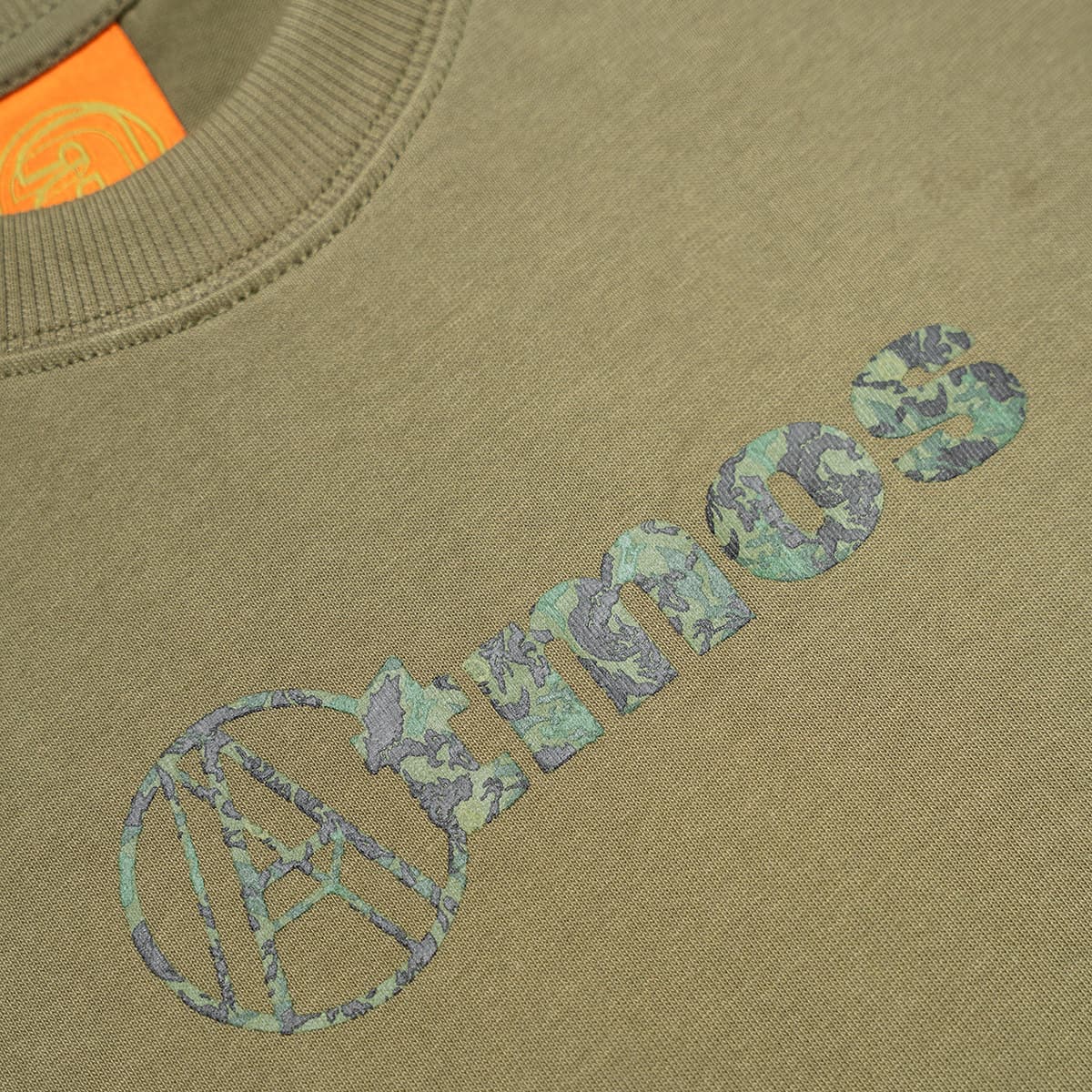 AGAINST LAB X ATMOS DRAGON LOGO TEE OLIVEの画像