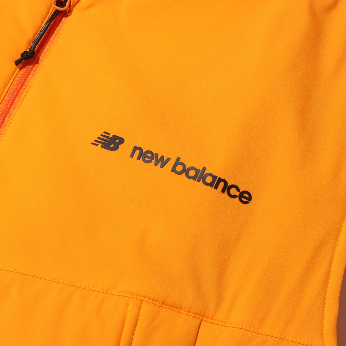 New Balance MET24 Packable Padded Vest マリーゴールド 23FW-Iの画像