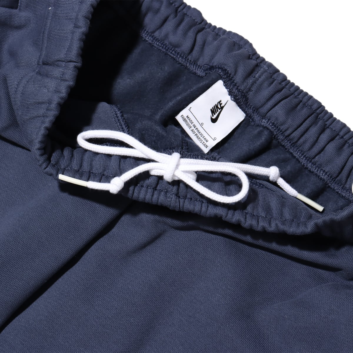 NIKE AS M NK SOLO SWSH FLC CF PANT THUNDER BLUE/WHITEの画像