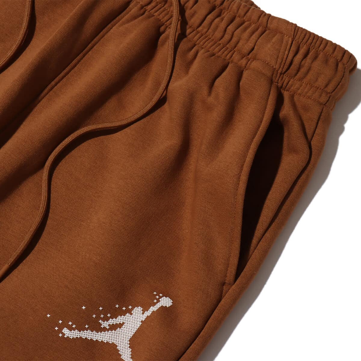 JORDAN BRAND AS M J ESS MMBR HLDY FLC PANT LT BRITISH TAN/SAIL 23HO-Iの画像