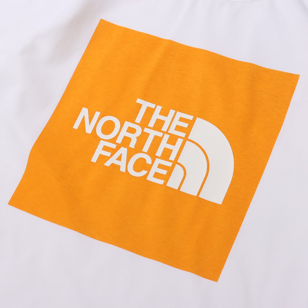 THE NORTH FACE S/S COLORED SQUARE LOGO TEE LIGHT EXVELANCE ORANGE 21SS-Iの画像