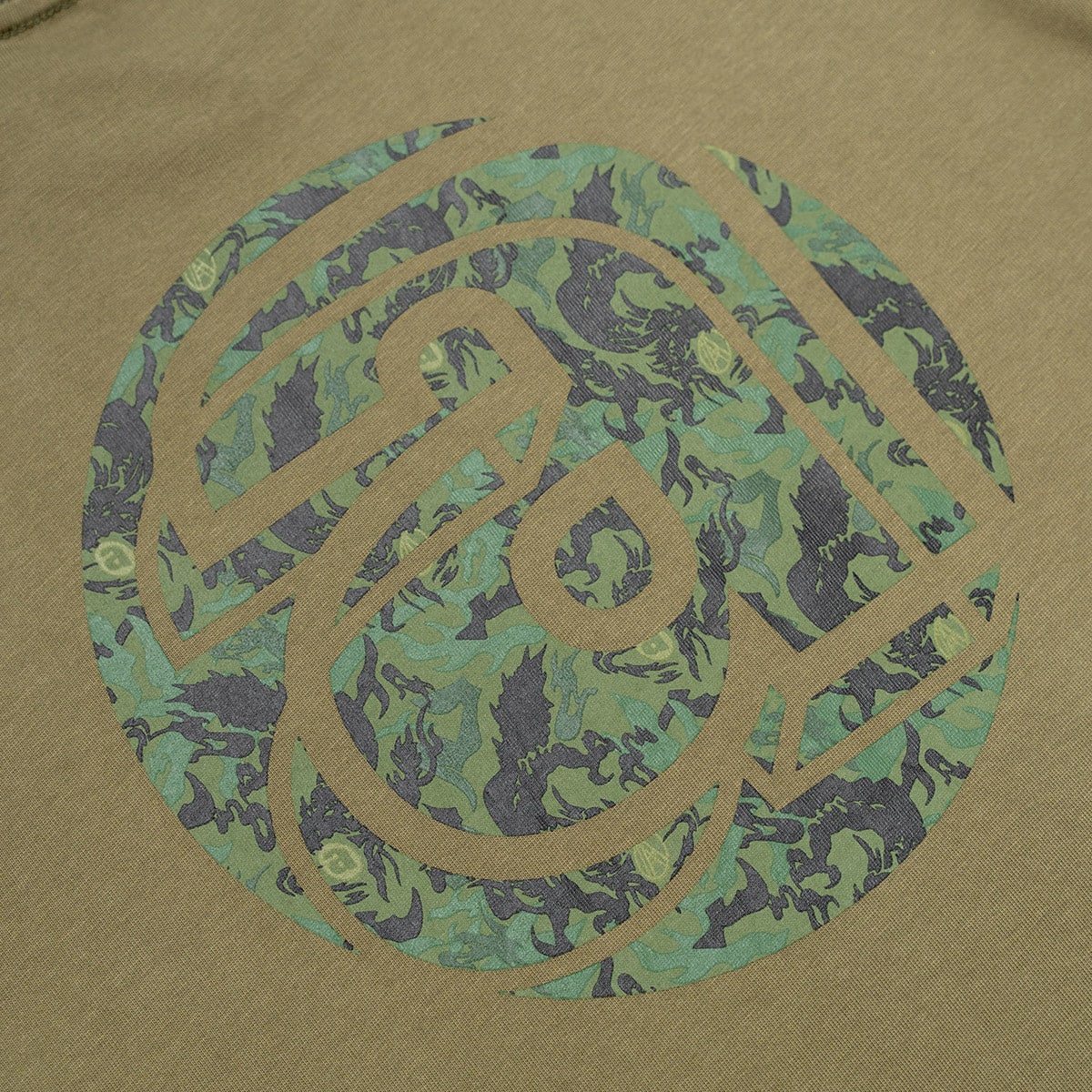 AGAINST LAB X ATMOS DRAGON LOGO TEE OLIVEの画像