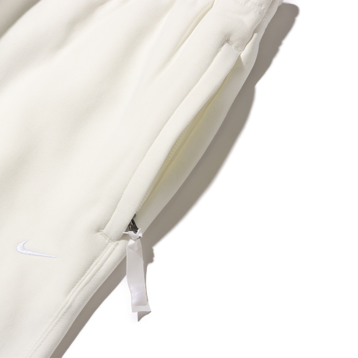NIKE AS M NK SOLO SWSH FLC CF PANT SAIL/WHITE 24SP-Iの画像