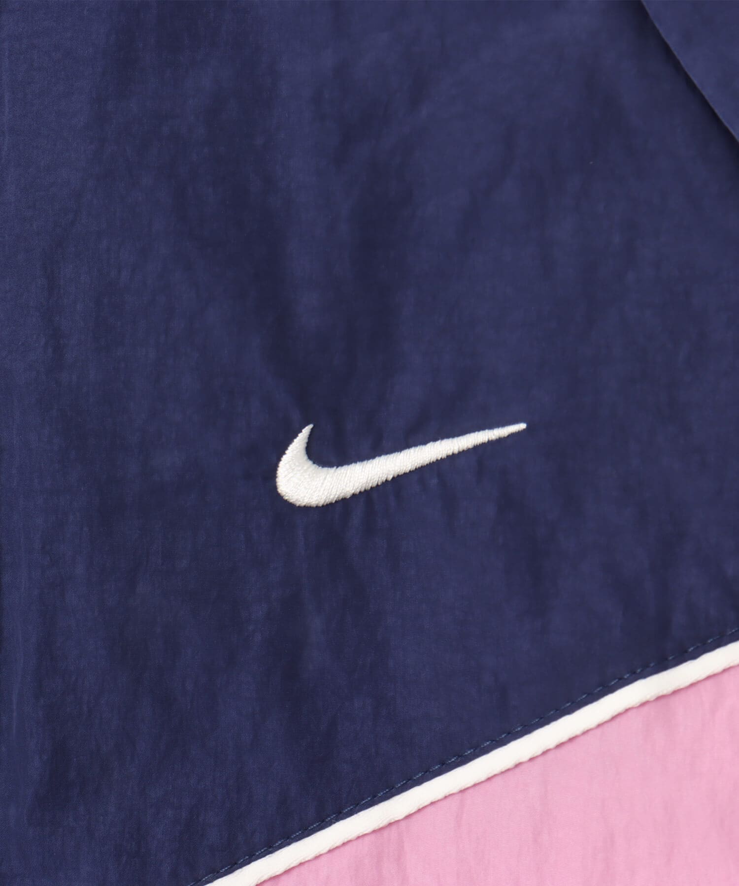 NIKE AS W NSW NK WR WVN UV FZ JKT MIDNIGHT NAVY/SAIL/PLAYFUL PINK/SAILの画像