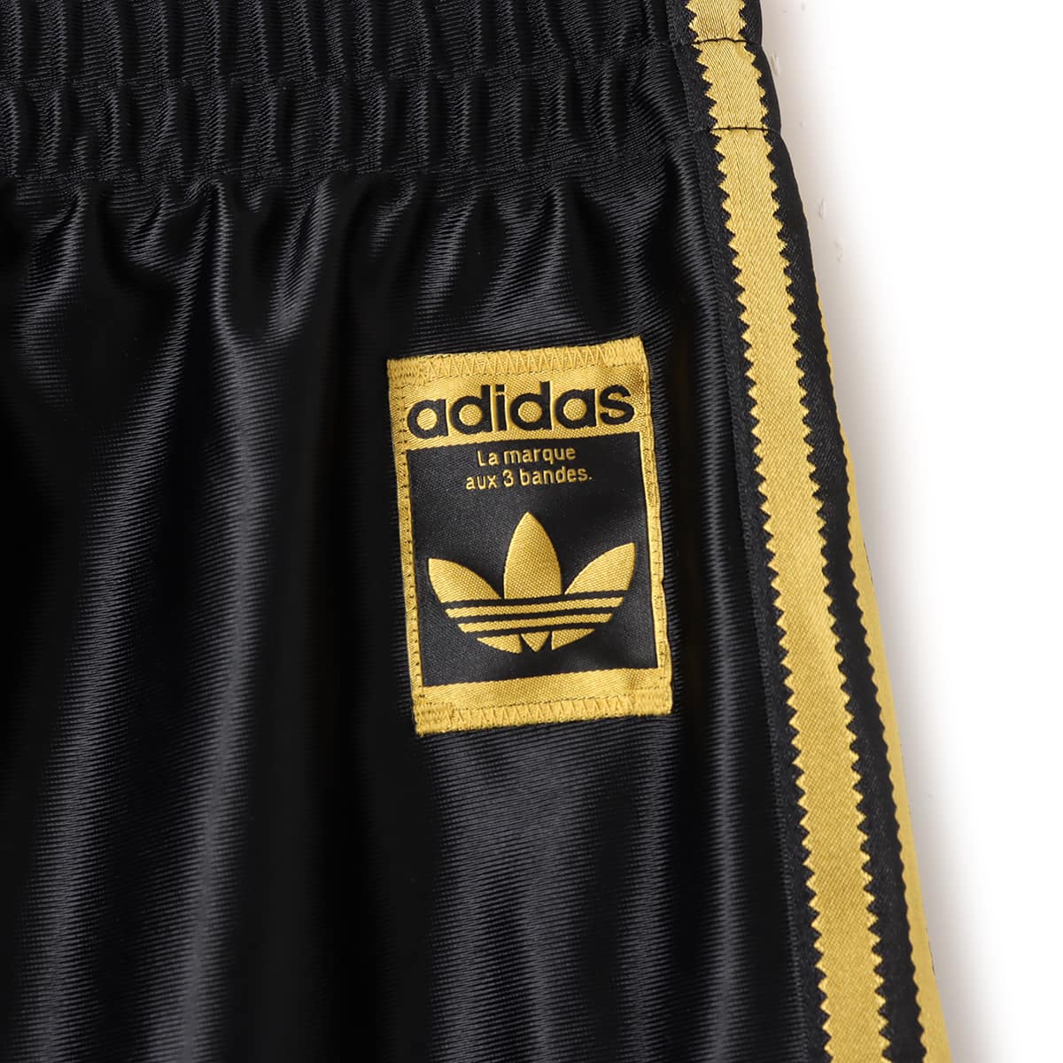 adidas SUPERSTAR TRACKPANTS ブラック/ゴールドメタリックの画像