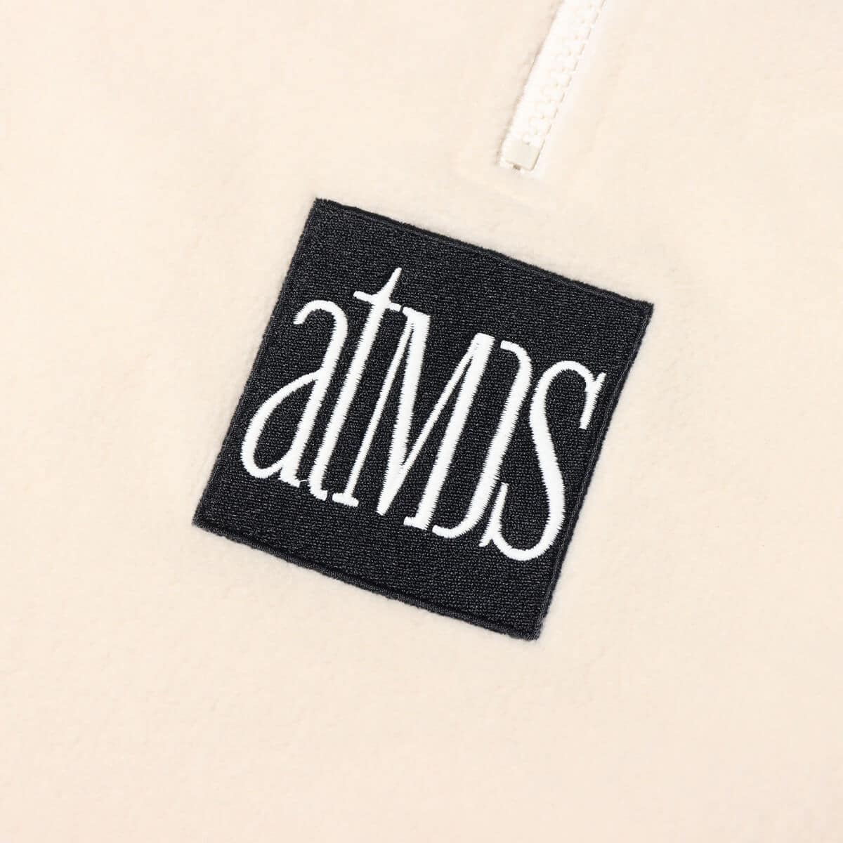 atmos HALF ZIP FREECE TOPS WHITEの画像