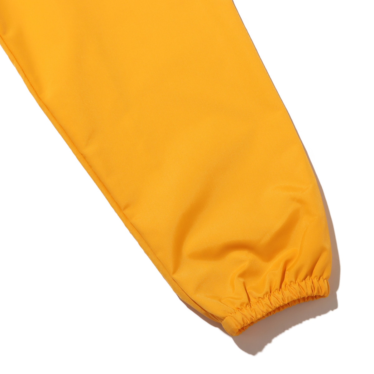 THE NORTH FACE NEVER STOP ING THE COACH JACKET サミットゴールドの画像