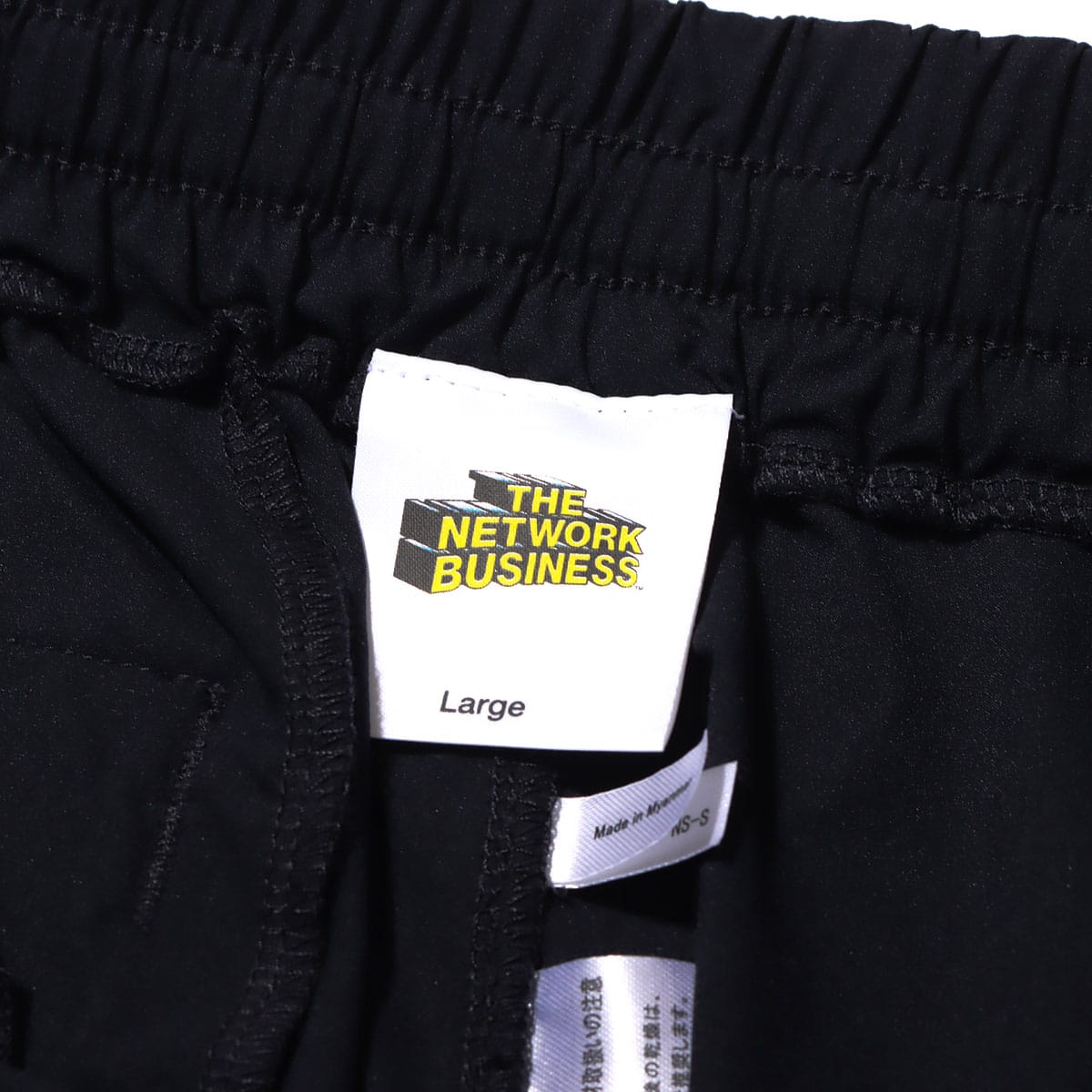 THE NETWORK BUSINESS WING LOGO EMBROIDERY NYLON SHORTS / ザ