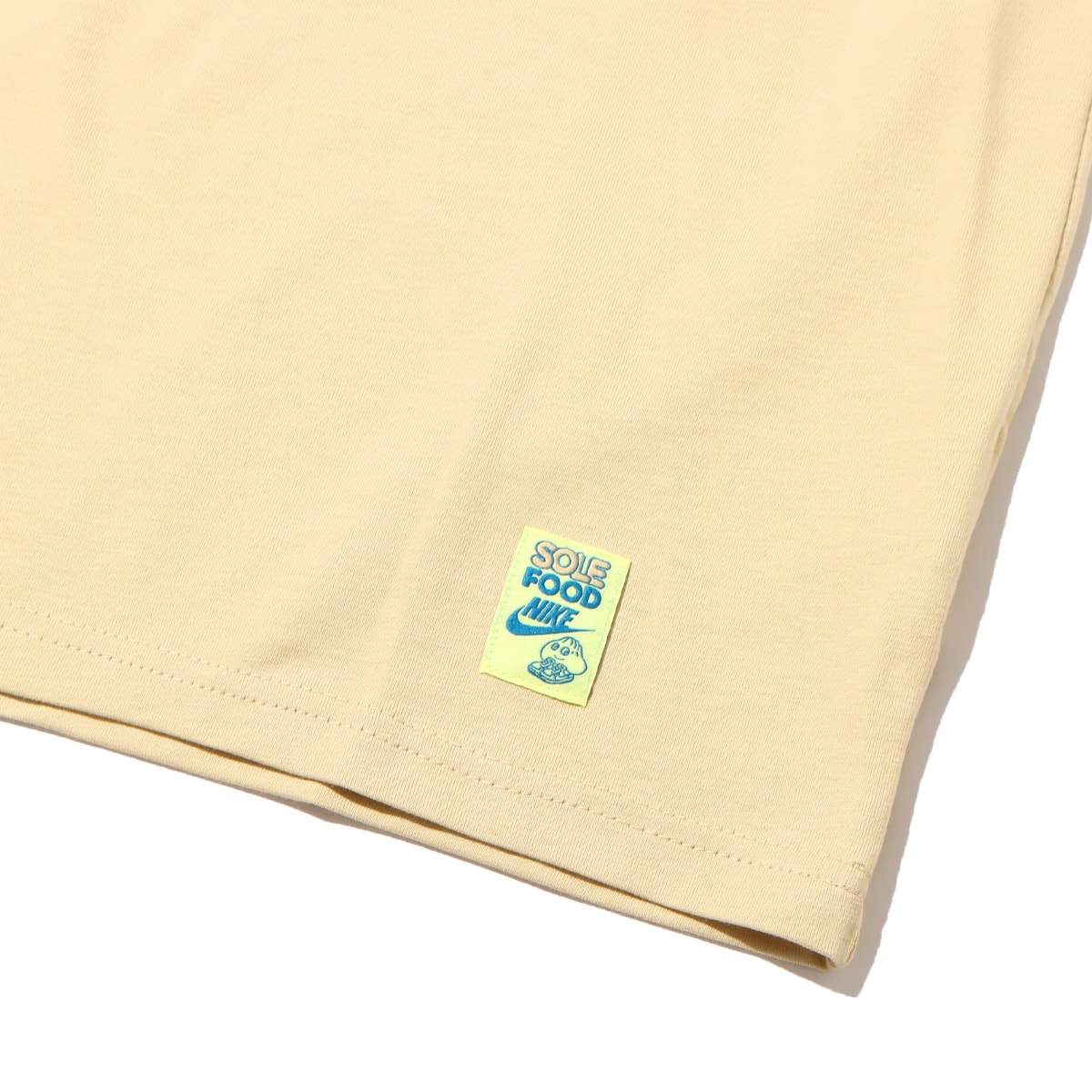 NIKE AS M NSW TEE M90 SOLE FOOD LBR TEAM GOLD 23SU-Iの画像