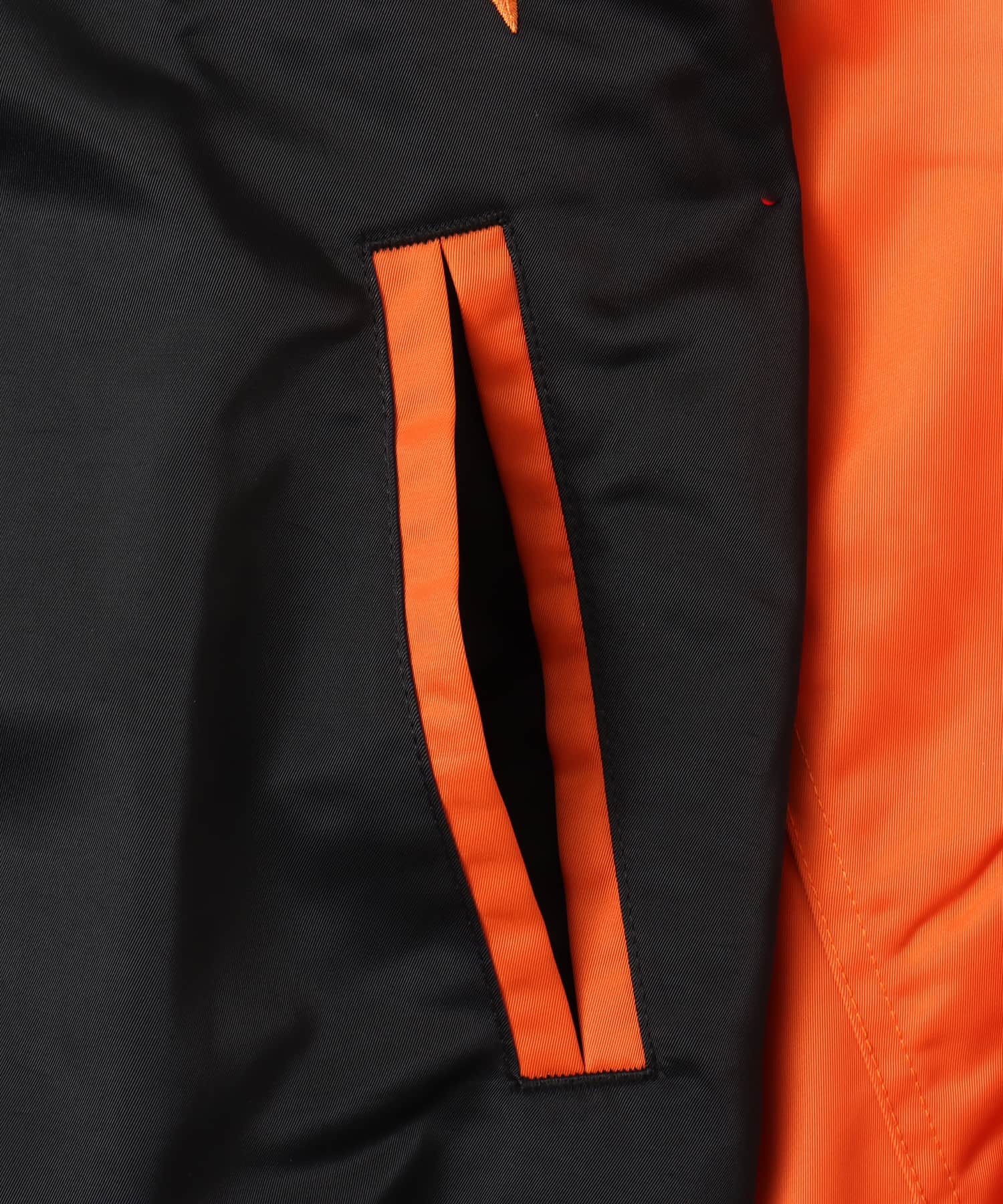 JORDAN BRAND M J BRK CLGTE VRSTY JKT BLACK/STARFISH/BLACKの画像