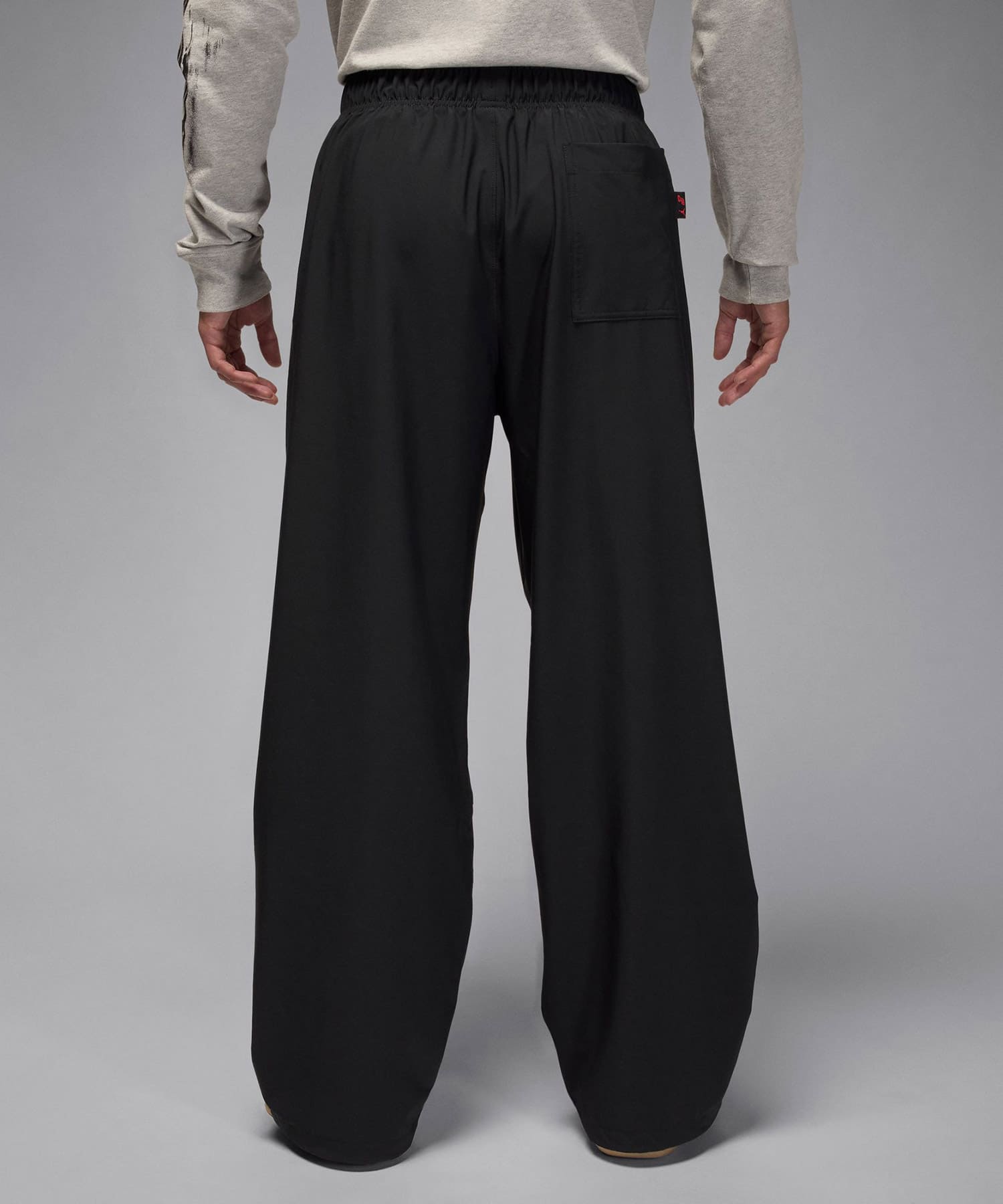 JORDAN BRAND M J DF SPRT WOVEN PANT JT BLACK/UNIVERSITY REDの画像