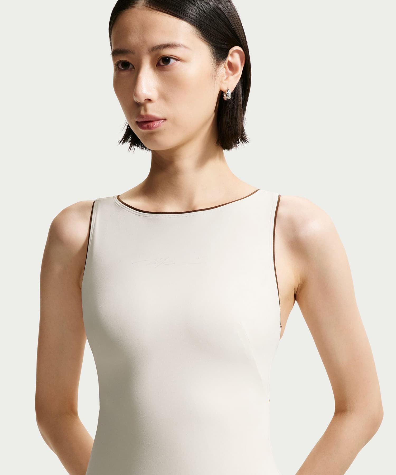 NIKE W NRG NK BODYSUIT OFFWHITEの画像