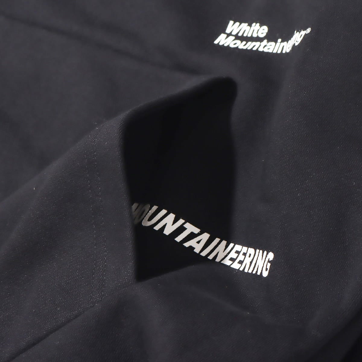 WHITE MOUNTAINEERING WM LOGO RANDAM PRINTED HOODIE BLACK 21FA-Iの画像