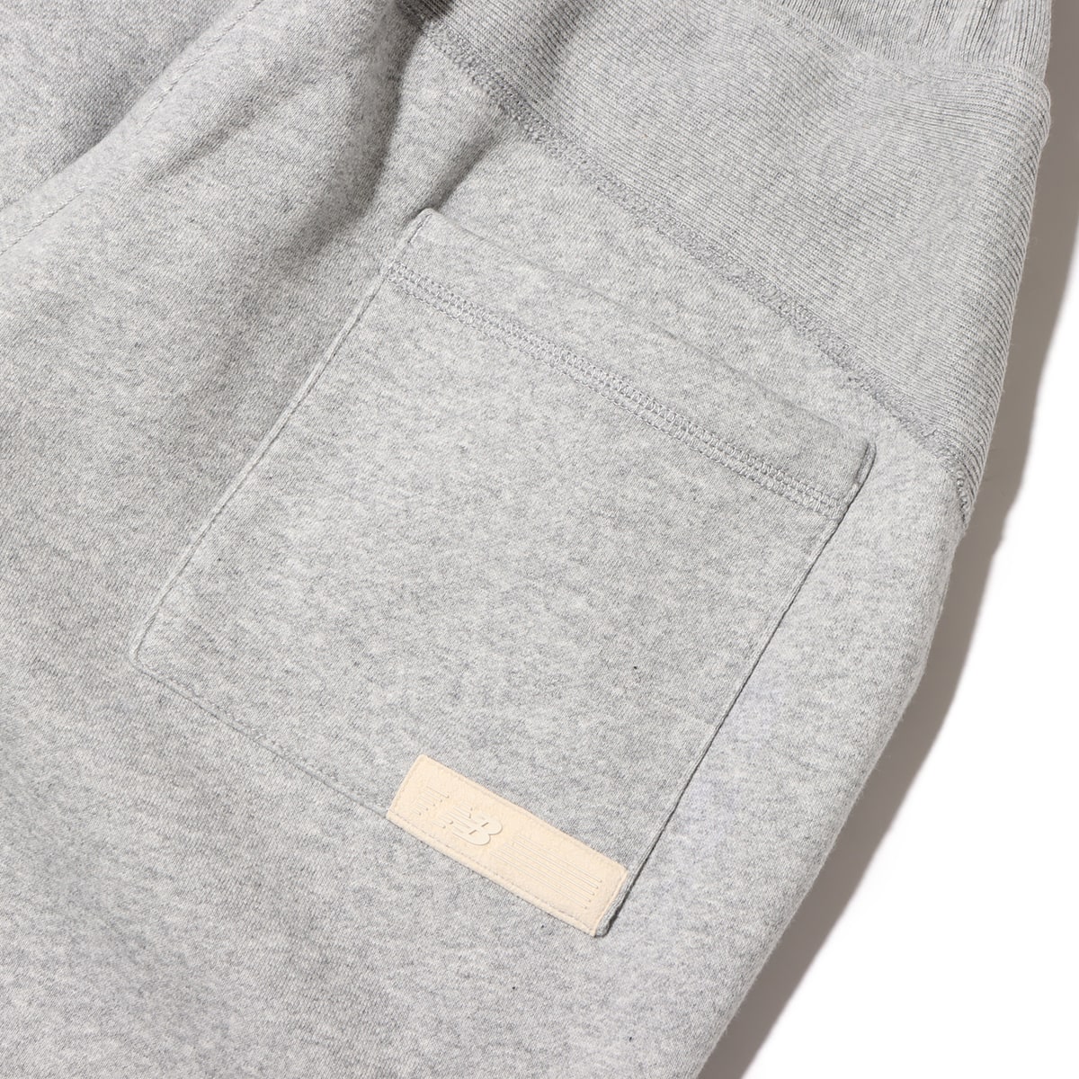 New Balance 1000 SWEAT PANTS OVERSIZED FIT アスレチックグレー 23FA-Iの画像