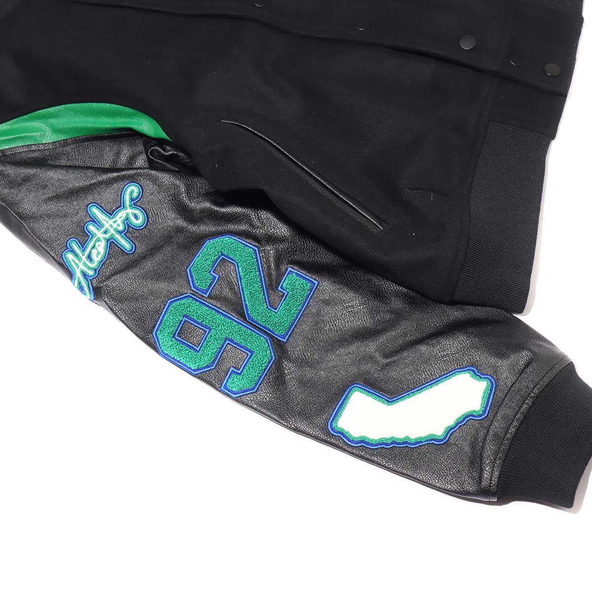 JORDAN BRAND AS W J SRT SP VARSITY JKT BLACK/GAME ROYAL/PINE GREEN 21SP-Sの画像