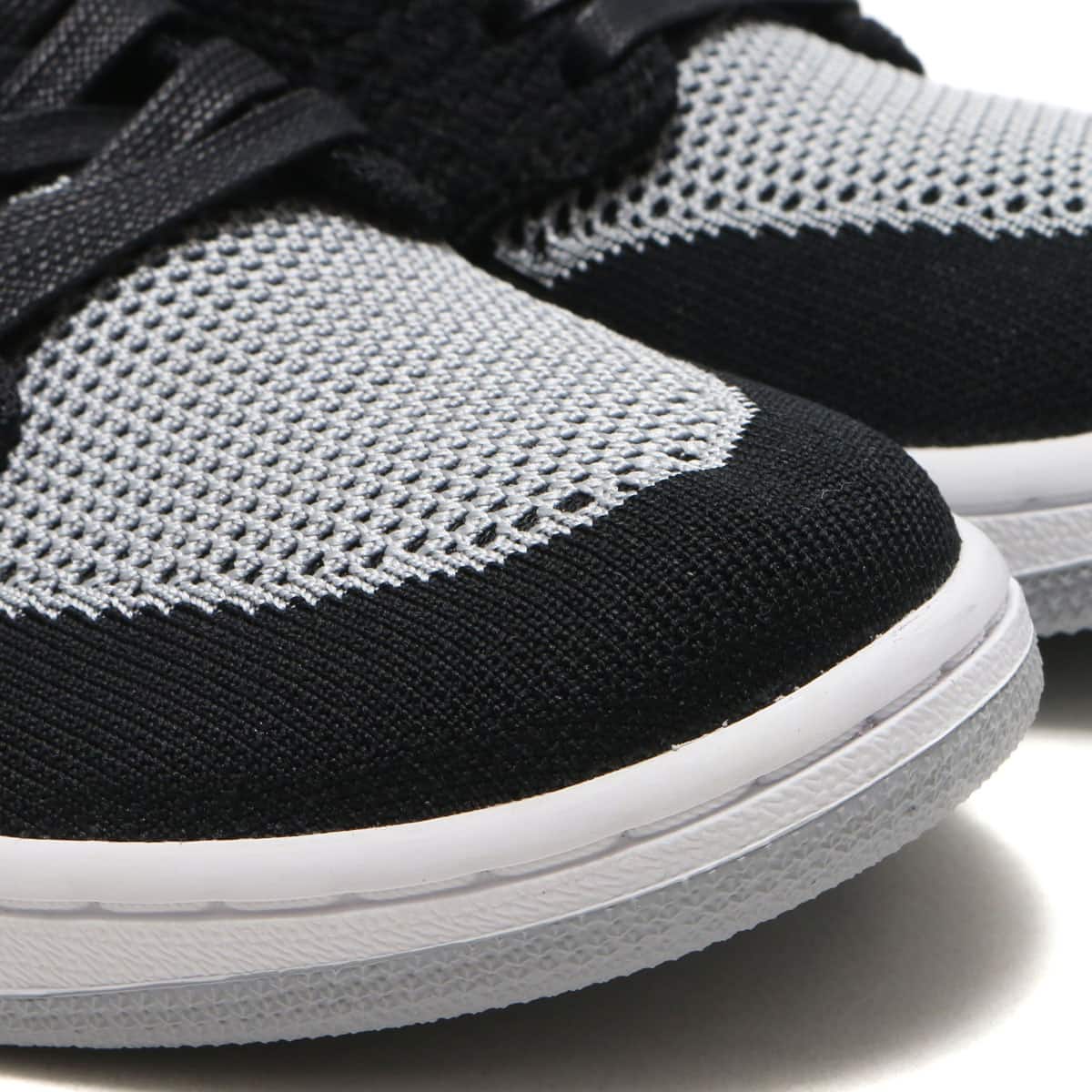 JORDAN BRAND AIR JORDAN 1 RETRO HI FLYKNIT BLACK/WOLF GREY