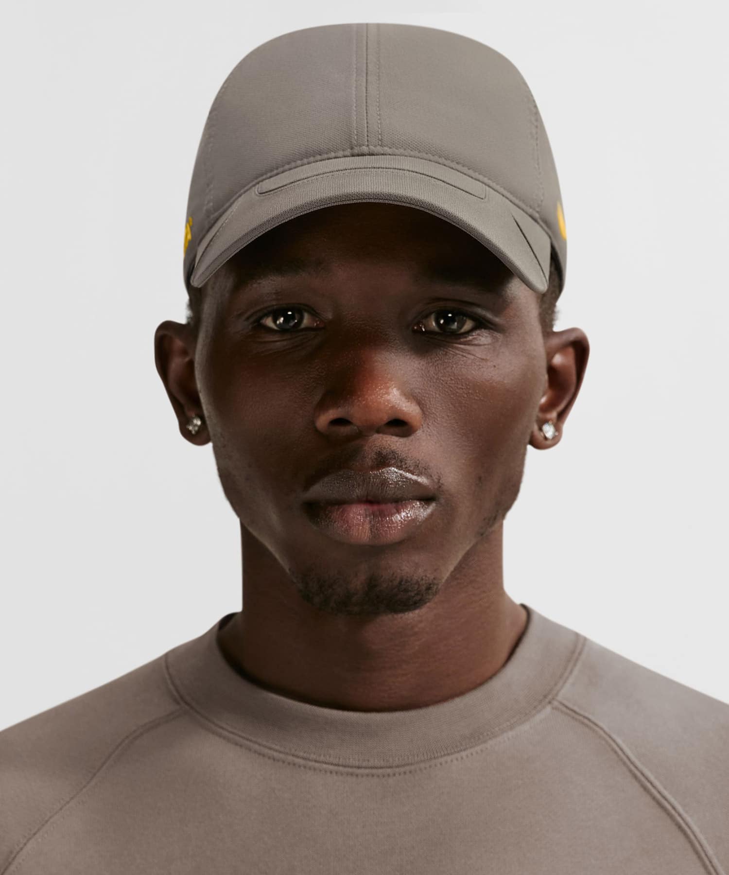 NIKE U NRG CLUB CAP NOCTA-USCB OLIVE GREY/YELLOW OCHREの画像