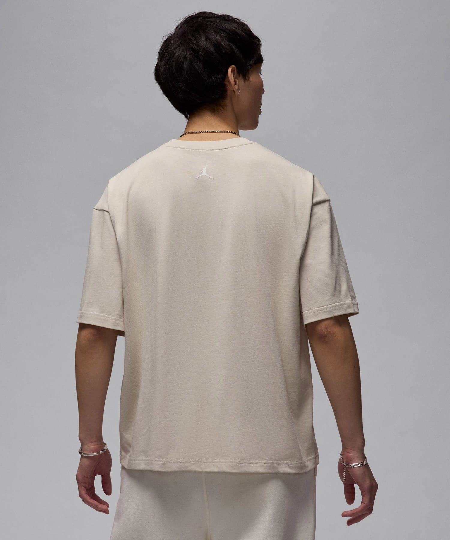 JORDAN BRAND M J FLT ESS BOXY SS CREW LT OREWOOD BRN/SAILの画像