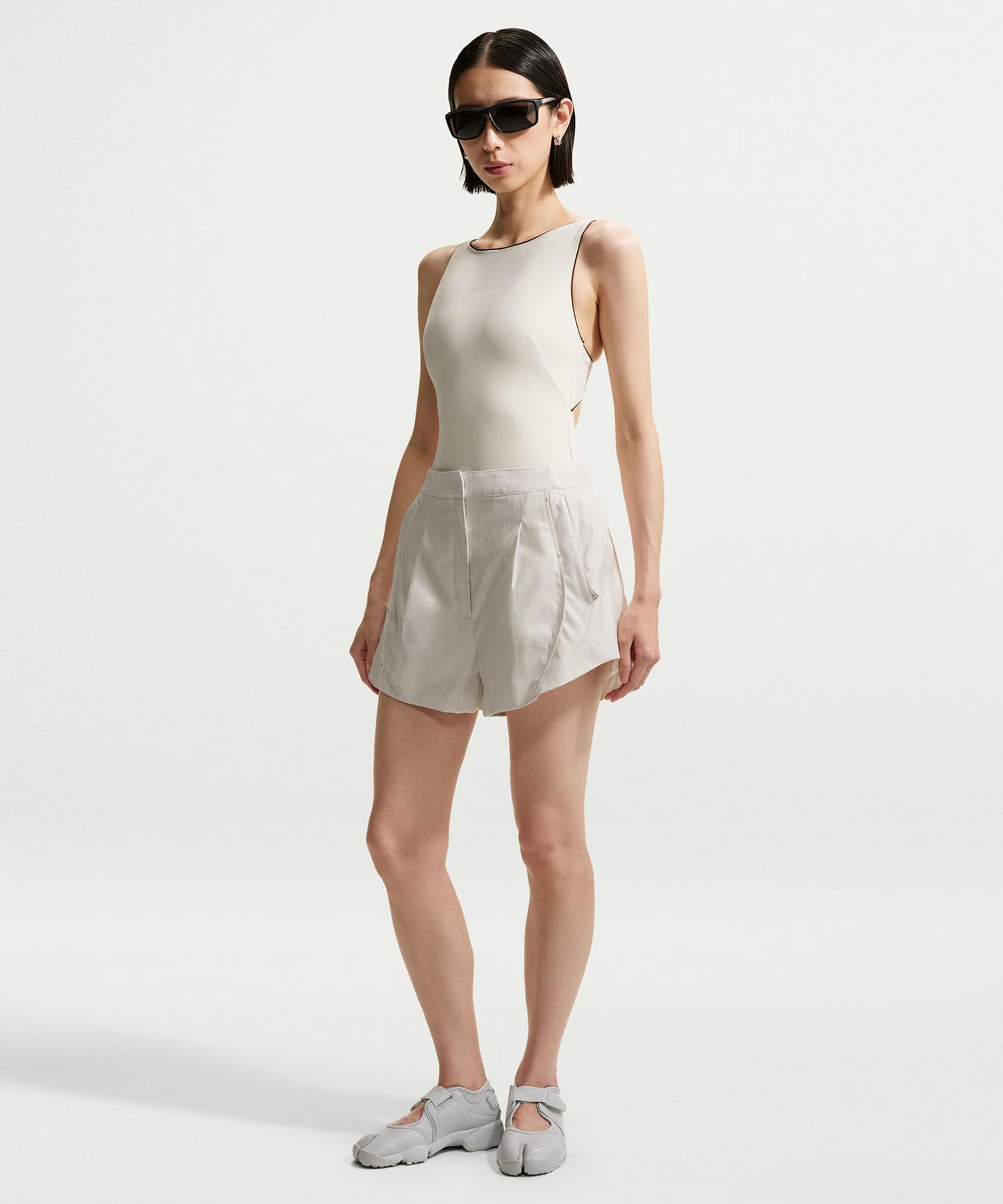 NIKE W NRG NK BODYSUIT OFFWHITEの画像