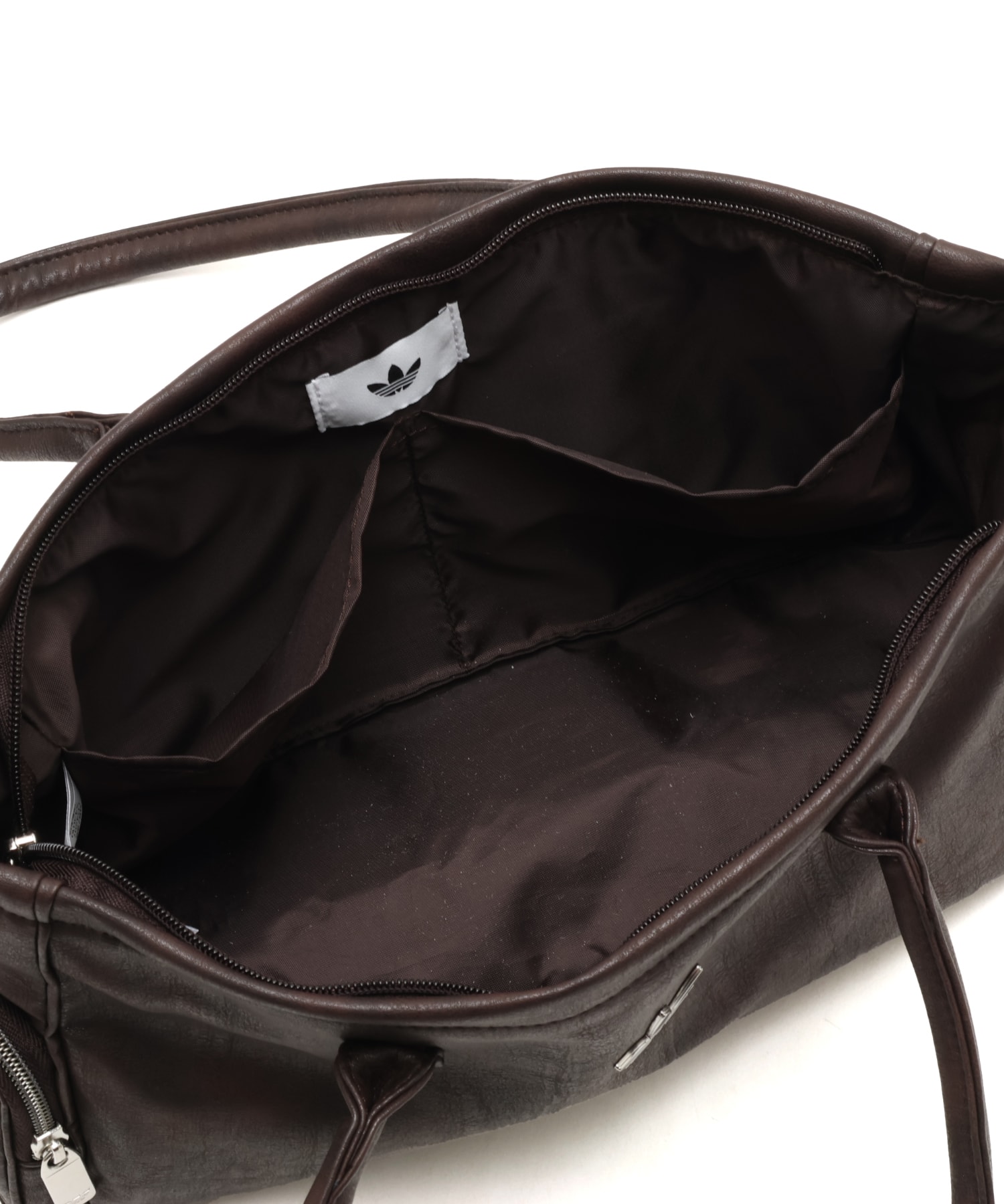 adidas ELONGATED BAG WITH POCKETS オーロラコーヒーの画像