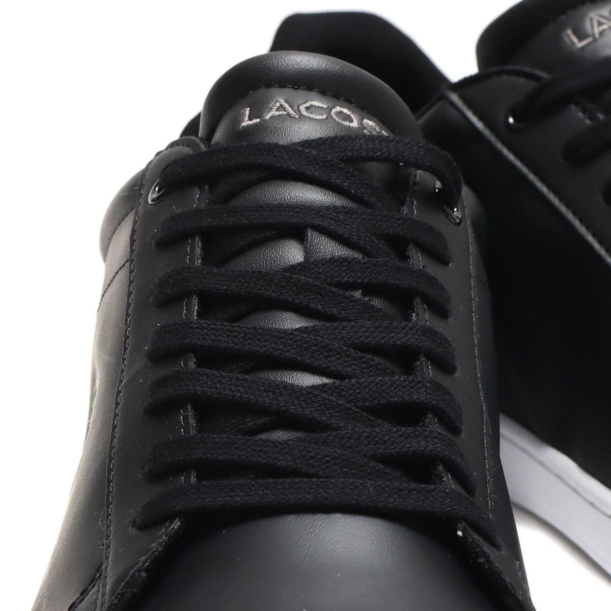 LACOSTE CARNABY EVO BL 21 BLK/WHT 22SU-Iの画像