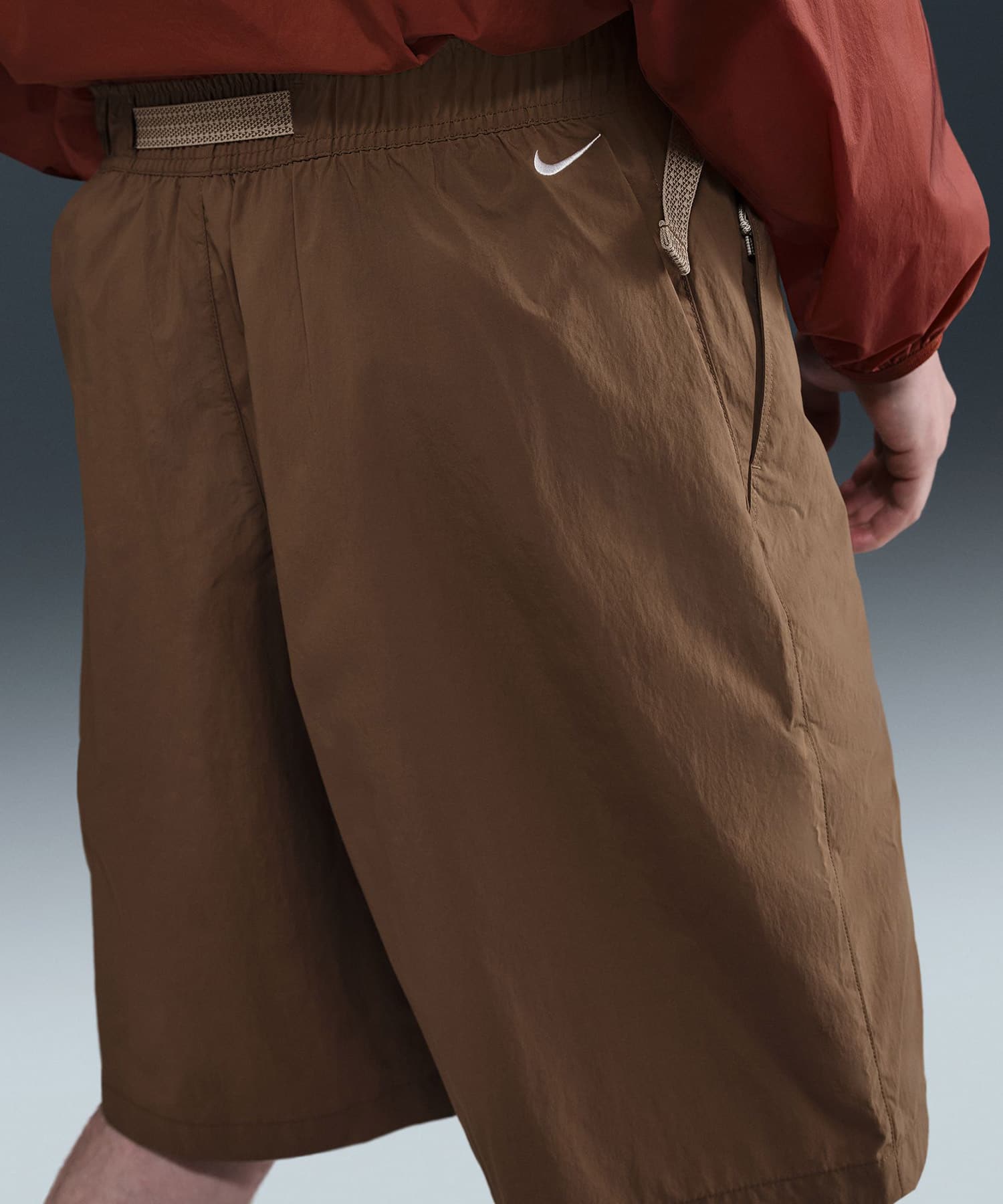 NIKE AS U ACG UV RPL ORB WVER OS SH MOSSWOOD BROWN/SUMMIT WHITEの画像