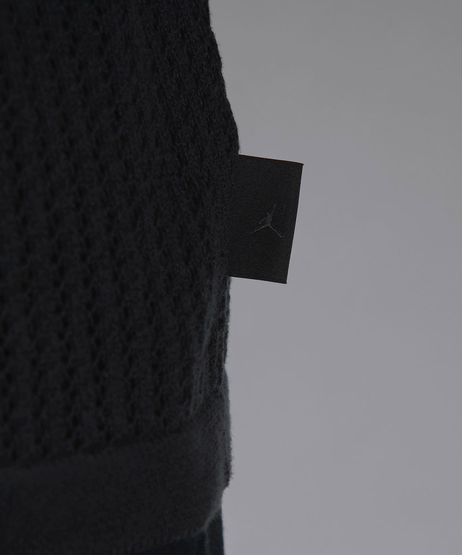 JORDAN BRAND M J AIR JDN KNIT FTBL JRSY OFF NOIR/DK SMOKE GREYの画像