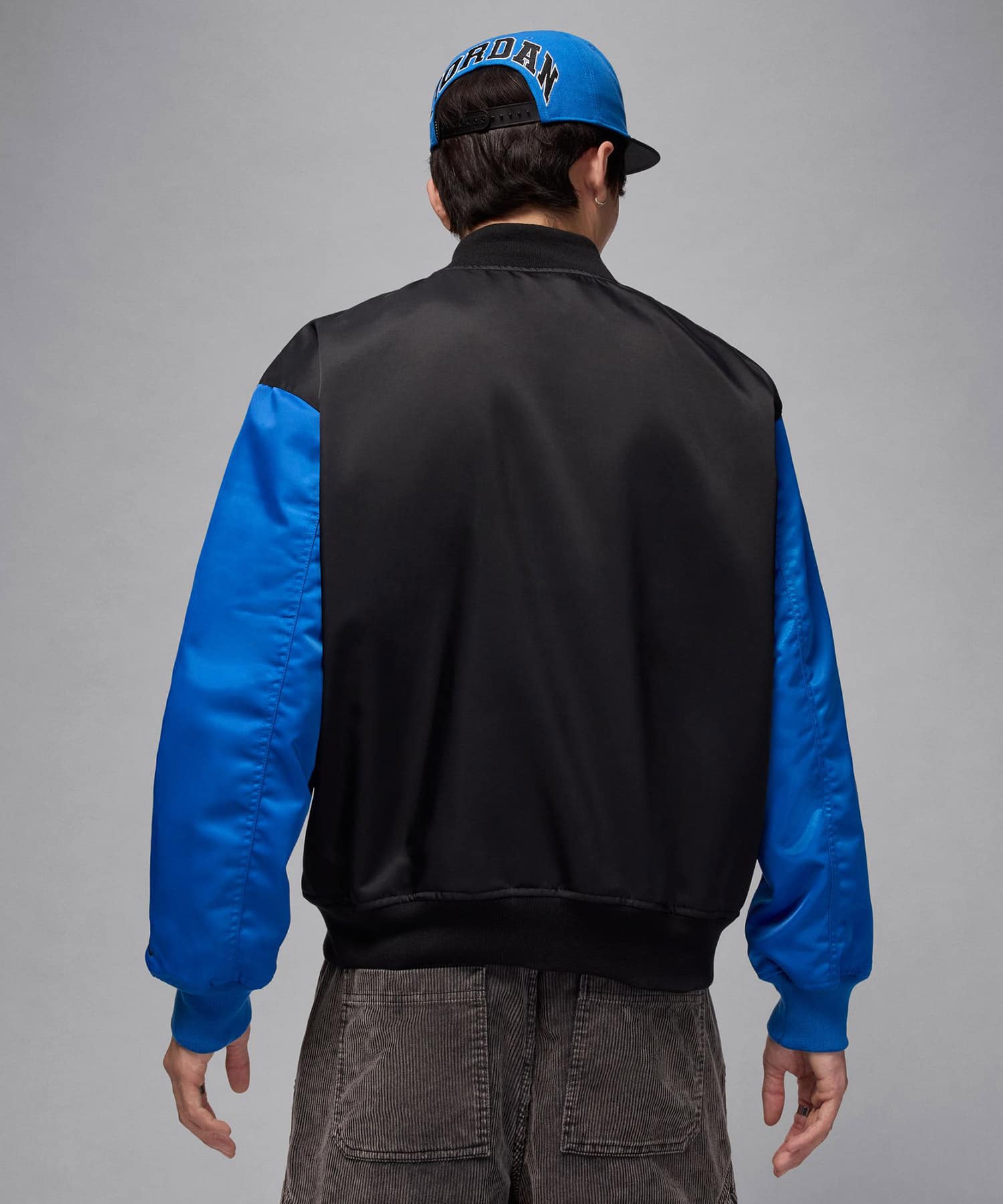 JORDAN BRAND M J BRK CLGTE VRSTY JKT BLACK/SPORT BLUE/BLACKの画像