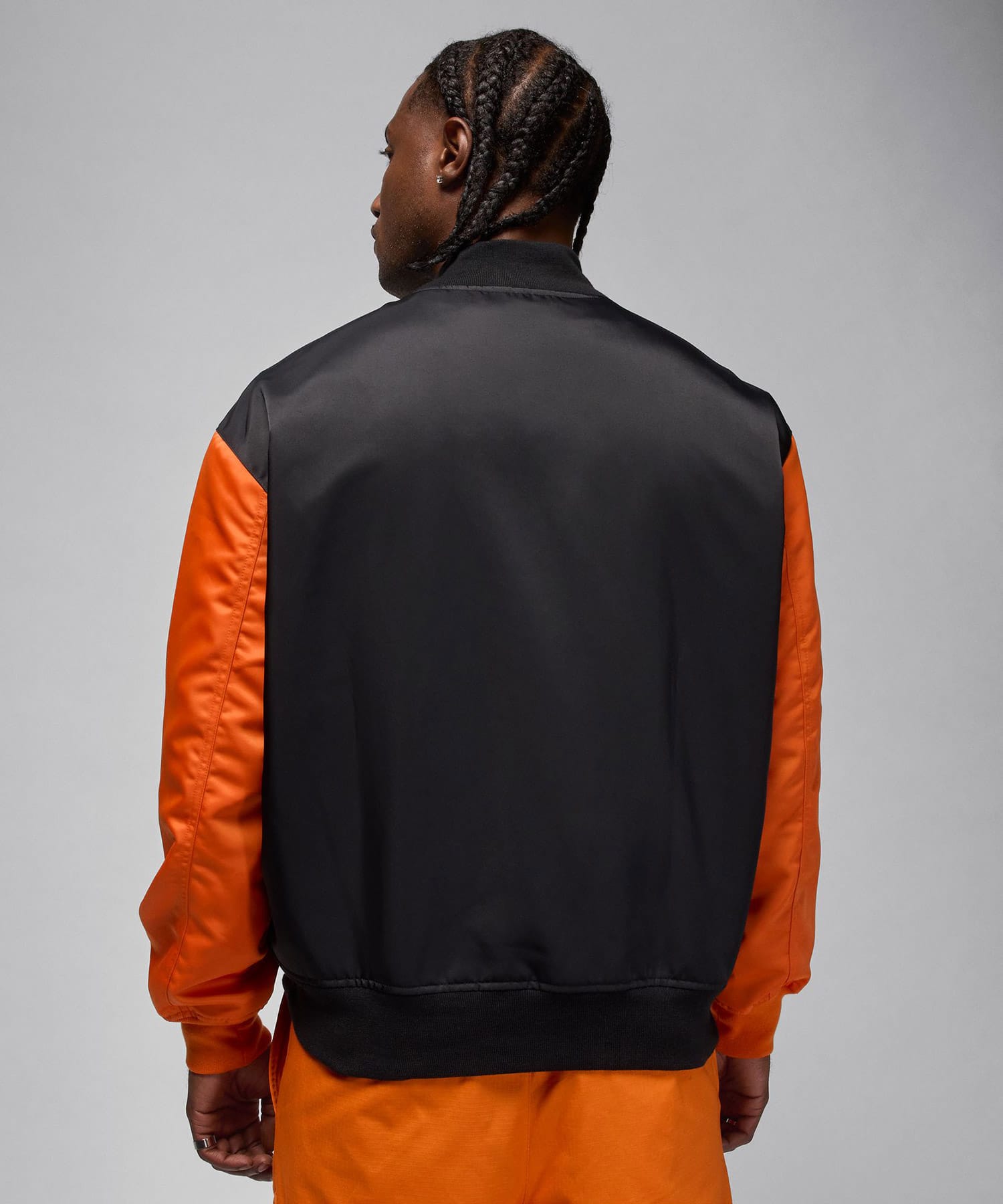 JORDAN BRAND M J BRK CLGTE VRSTY JKT BLACK/STARFISH/BLACKの画像