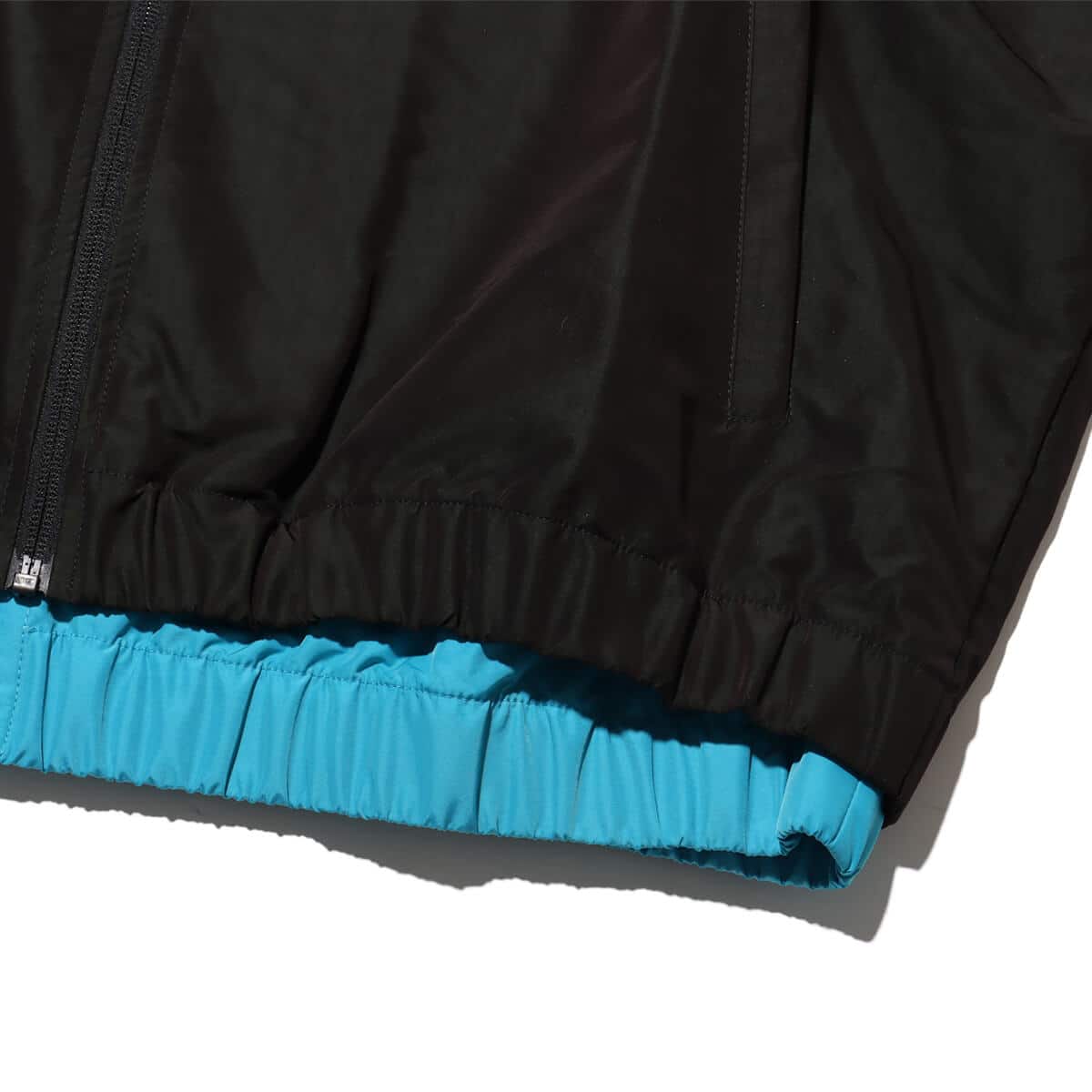 Reebok BOTTER VECTOR TRACK JACKET BLACK/BLUEの画像