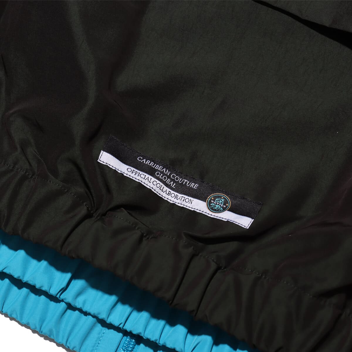 Reebok BOTTER VECTOR TRACK JACKET BLACK/BLUEの画像