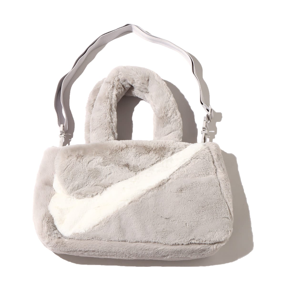 NIKE W NSW FX FUR TOTE LT IRON ORE/LT IRON ORE/SAIL 22HO-I